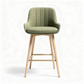 Green upholstered bar stool with wooden legs and gold accents 45 x 50 x 100cm